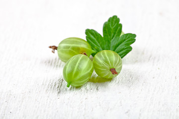 Image showing three gooseberries with leaves 