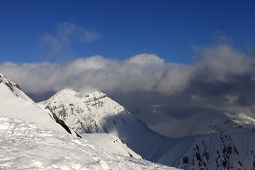 Image showing Winter mountains and blue sky with clouds