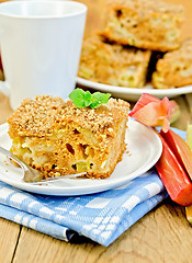 Image showing Pie with rhubarb and mint on the board