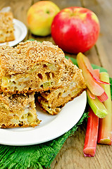 Image showing Pie rhubarb and apple on a wooden board