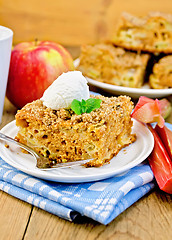 Image showing Pie with rhubarb  and ice cream on the board