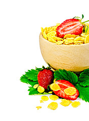 Image showing Corn flakes in a wooden bowl with strawberries
