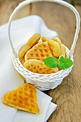 Image showing Biscuit in the shape of hearts in a white basket with mint