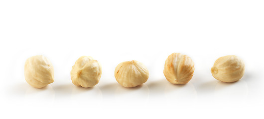 Image showing Closeup view of hazelnuts over white background