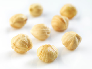 Image showing Closeup view of hazelnuts over white background