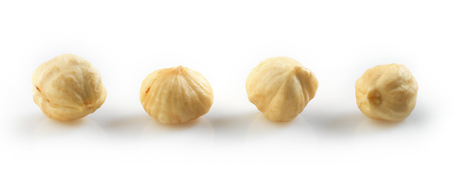 Image showing Closeup view of hazelnuts over white background