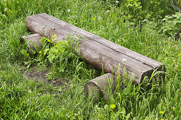 Image showing Bench made in log in village street