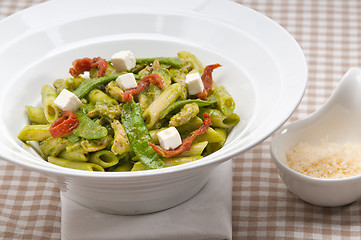 Image showing Italian penne pasta with sundried tomato and basil