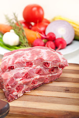 Image showing chopping fresh pork ribs and vegetables