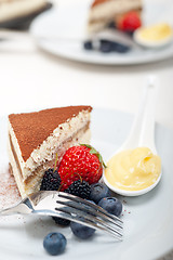 Image showing tiramisu dessert with berries and cream