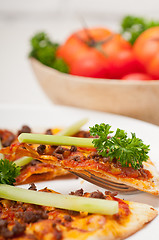 Image showing Turkish beef pizza with cucumber on top