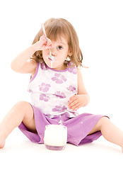 Image showing little girl with yogurt
