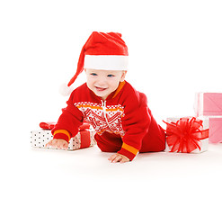 Image showing santa helper baby with christmas gifts