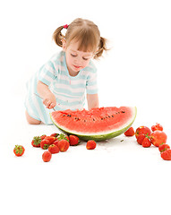 Image showing little girl with strawberry and watermelon