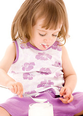 Image showing little girl with yogurt