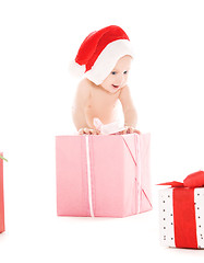 Image showing santa helper baby with christmas gifts