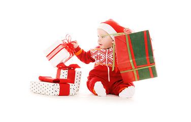 Image showing santa helper baby with christmas gifts