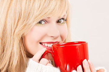 Image showing happy teenage girl with red mug