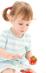 Image showing little girl with strawberry