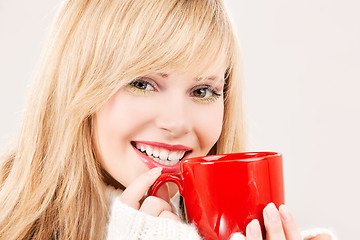 Image showing happy teenage girl with red mug