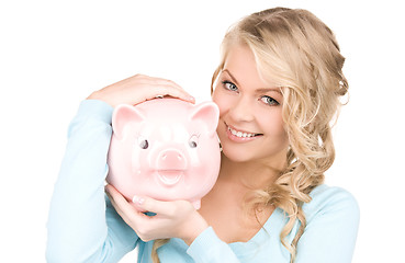 Image showing lovely woman with piggy bank