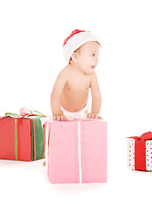 Image showing santa helper baby with christmas gifts