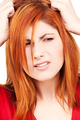 Image showing unhappy redhead woman