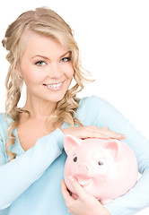 Image showing lovely woman with piggy bank