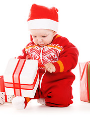 Image showing santa helper baby with christmas gifts