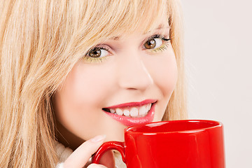 Image showing happy teenage girl with red mug