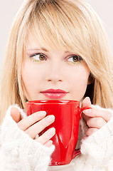 Image showing lovely teenage girl with red mug