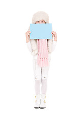 Image showing girl in winter hat with blank board