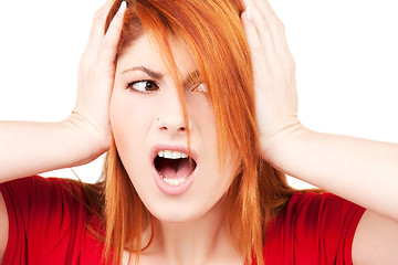 Image showing unhappy redhead woman