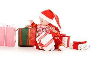 Image showing santa helper baby with christmas gifts