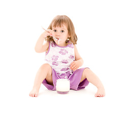 Image showing little girl with yogurt