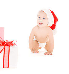 Image showing santa helper baby with christmas gifts