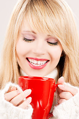 Image showing happy teenage girl with red mug