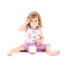 Image showing little girl with yogurt