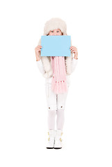 Image showing girl in winter hat with blank board