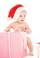 Image showing santa helper baby with christmas gifts