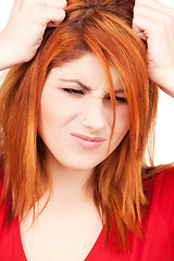 Image showing unhappy redhead woman