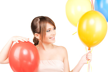 Image showing happy teenage girl with balloons