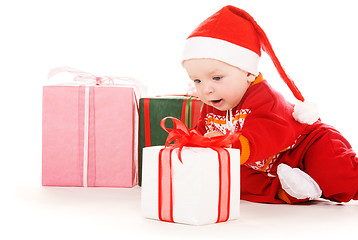 Image showing santa helper baby with christmas gifts