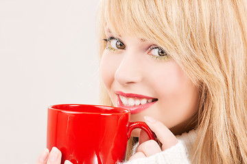 Image showing happy teenage girl with red mug