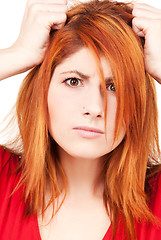 Image showing unhappy redhead woman