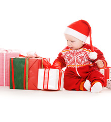 Image showing santa helper baby with christmas gifts