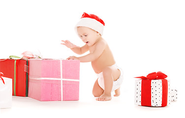 Image showing santa helper baby with christmas gifts