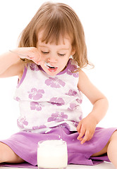 Image showing little girl with yogurt