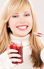 Image showing happy teenage girl with raspberry jam