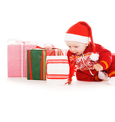 Image showing santa helper baby with christmas gifts